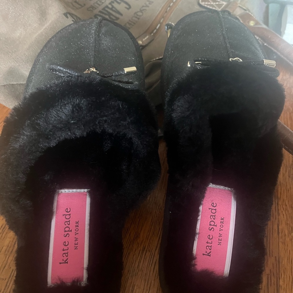 Ladies black slip on slippers by Kate Spade. Never worn. No tags